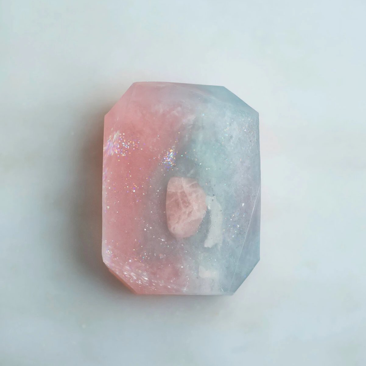 Crystallized soap named Love Spelled by Crystal Irie featuring a transparent, shimmering soap with embedded crystal-like elements.