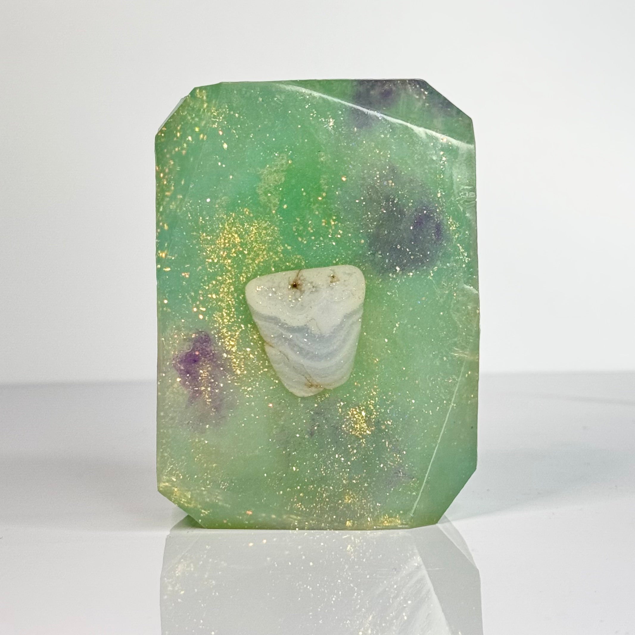 Crystal Irie Psyche crystal soap with a clear, smooth soap bar featuring embedded crystal details, displayed on a neutral background.