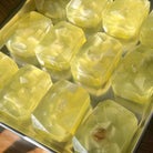 Crystal Irie Solar Healing crystal soap with natural crystal pieces in a clear soap bar, designed for energetic healing and skincare.