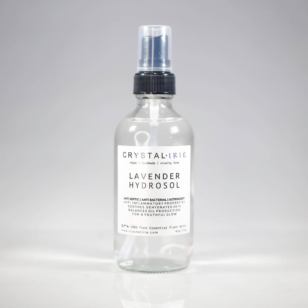 Lavender hydrosol bottle from Crystal Irie with a clear glass container and a white spray nozzle, displayed on a neutral background.