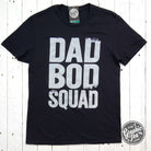 Black ink Dad Bod Squad graphic T-shirt by The Graphic Tee, short sleeve design with bold print on soft fabric.