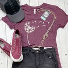 Maroon Dandelion Graphic Tee by The Graphic Tee, short sleeve V-neck tribal-inspired design on soft triblend fabric.
