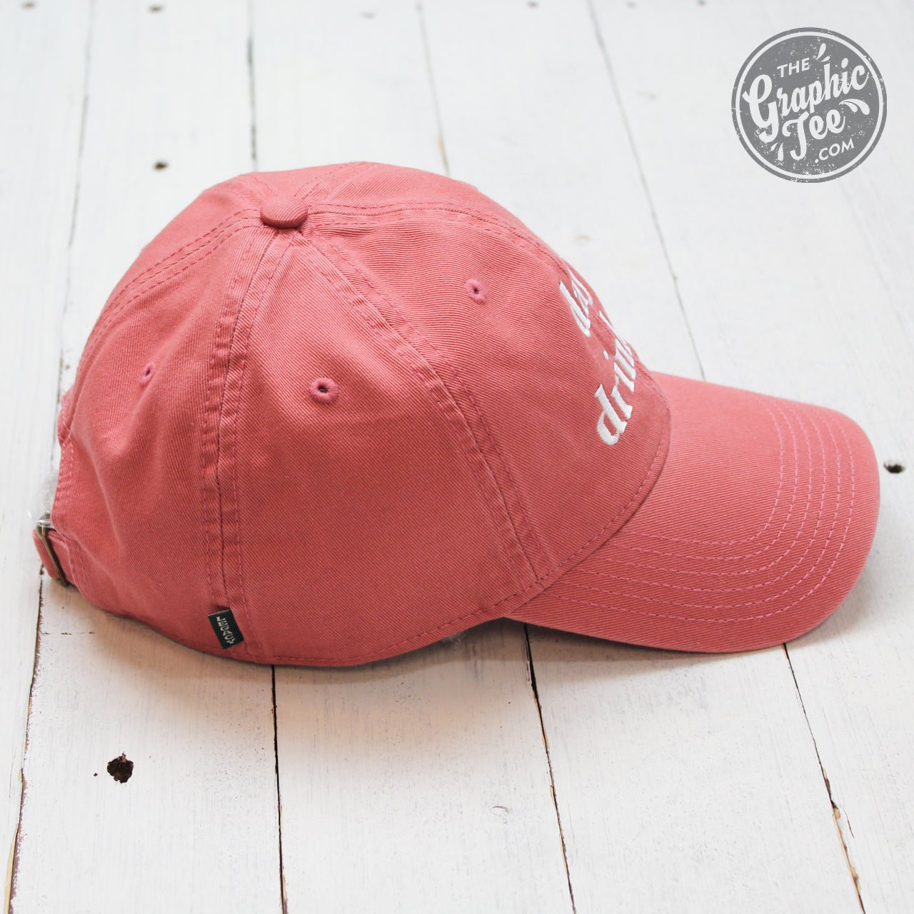 Nantucket Red relaxed twill dad hat by The Graphic Tee, featuring a casual cap style with adjustable strap and stitched branding.
