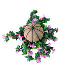 Pink artificial petunia flowering hanging basket with UV-resistant design, showcasing vibrant blooms from a bottom view.
