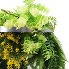 Artificial hanging plant chandelier with bright tropical foliage and draping ferns, silver ring frame, UV resistant, 15.75-inch diameter.