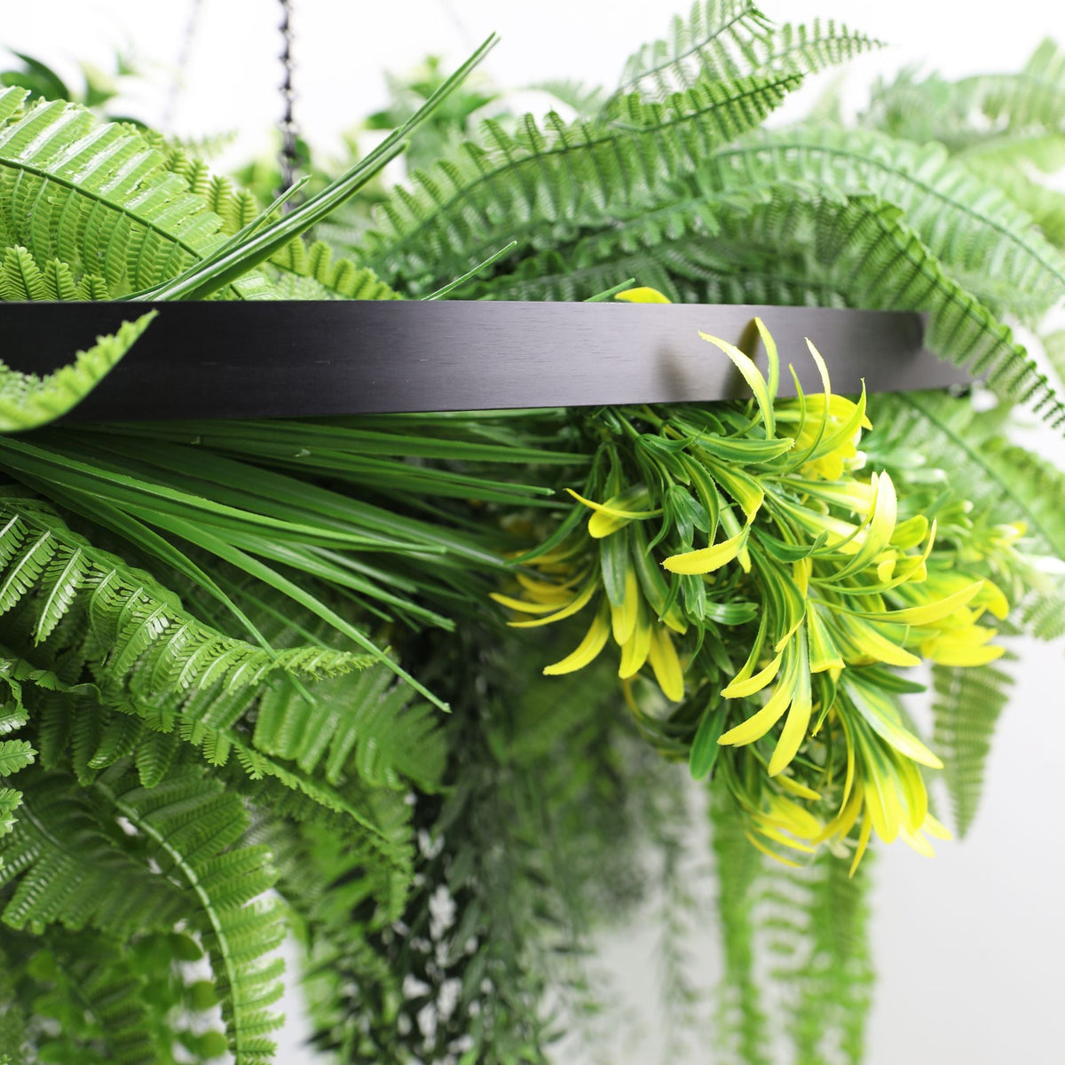 Artificial hanging fern chandelier with black frame, draping UV-resistant ferns, perfect for indoor or outdoor decor.