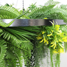 Artificial hanging fern chandelier with a silver circular frame, draping UV-resistant faux ferns and plants, 31.5 inches diameter.
