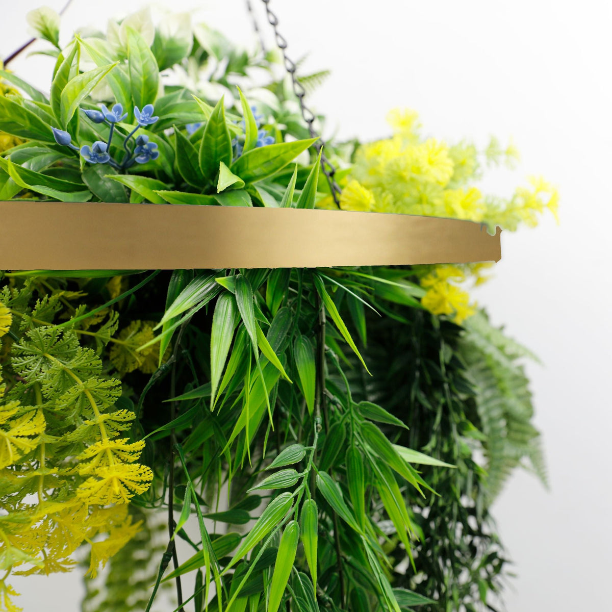 Artificial hanging plant chandelier with tropical foliage and draping stems in a gold frame, UV resistant for outdoor decor.