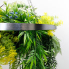 Artificial hanging plant chandelier with tropical foliage, circular silver frame, UV resistant faux greenery, 23.5-inch diameter.