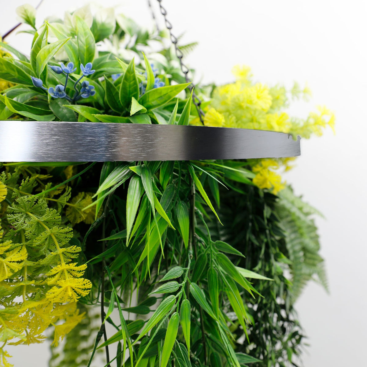 Artificial hanging plant chandelier with tropical foliage, circular silver frame, UV resistant faux greenery, 23.5-inch diameter.