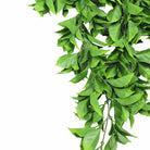 Artificial Dense Flowering Pothos hanging bush, UV resistant, fire-rated, 10.6x28.5 inches, ideal for indoor or outdoor decor.