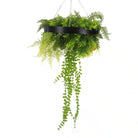 Black-framed draping artificial roof hanging disc with lush, life-like ferns and plants, UV resistant for outdoor decor.