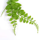 Light green artificial button fern hanging plant from Designer Plants USA, UV resistant, measures 31 inches tall.