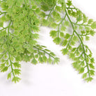 Artificial light green maidenhair fern hanging plant, 31 inches tall, UV resistant, realistic-looking leaves for indoor or outdoor decor.
