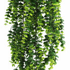 Artificial lush green eucalyptus garland, Designer Plants USA, 7.1x30.5 inches, UV resistant, fire-rated hanging bush for decor.