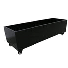 Medium black metal planter with wheels for artificial hedges, shown from a side view, designed for garden or outdoor installation.