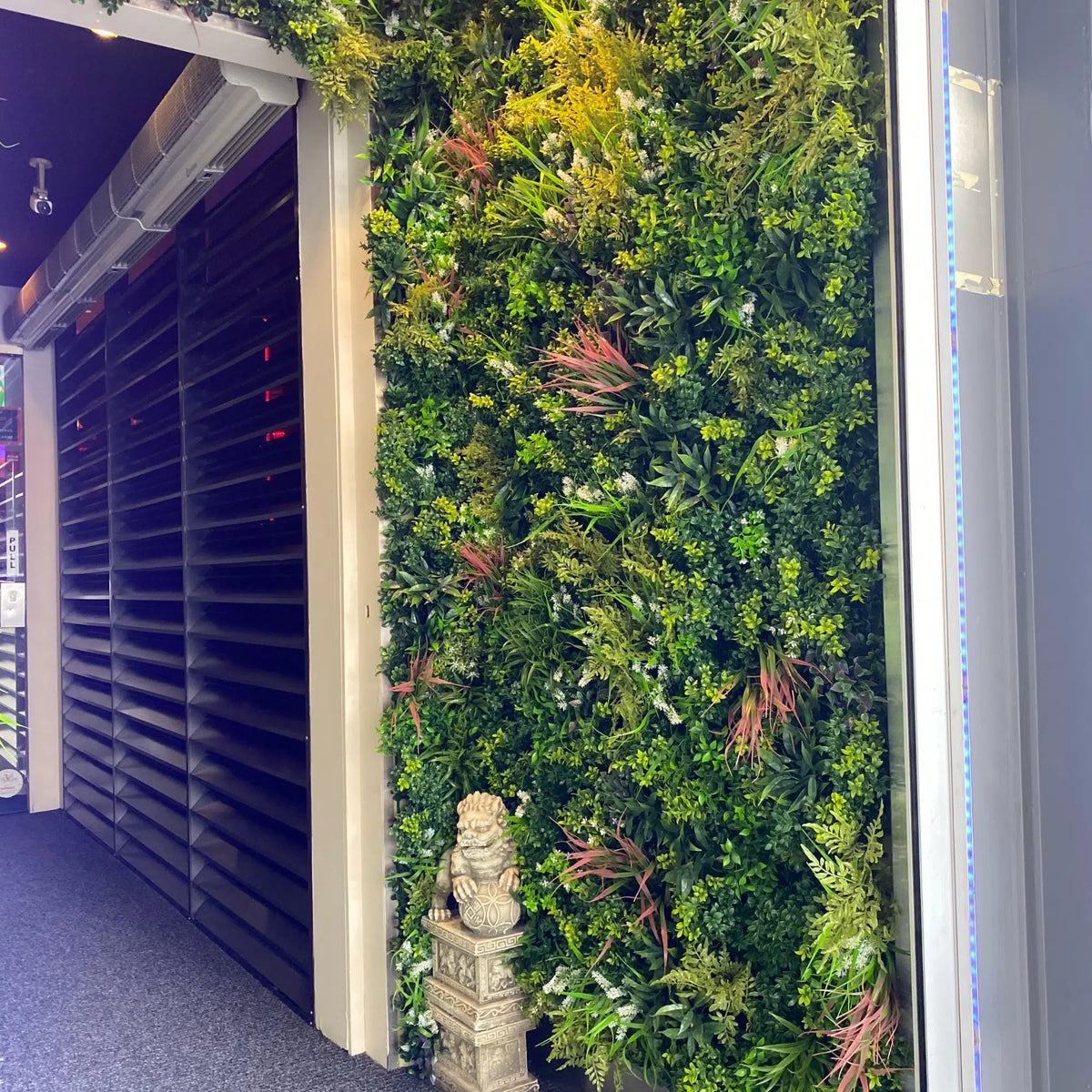 Artificial Amazon Jungle vertical garden panel by Designer Plants USA, UV resistant living wall for commercial or outdoor use.