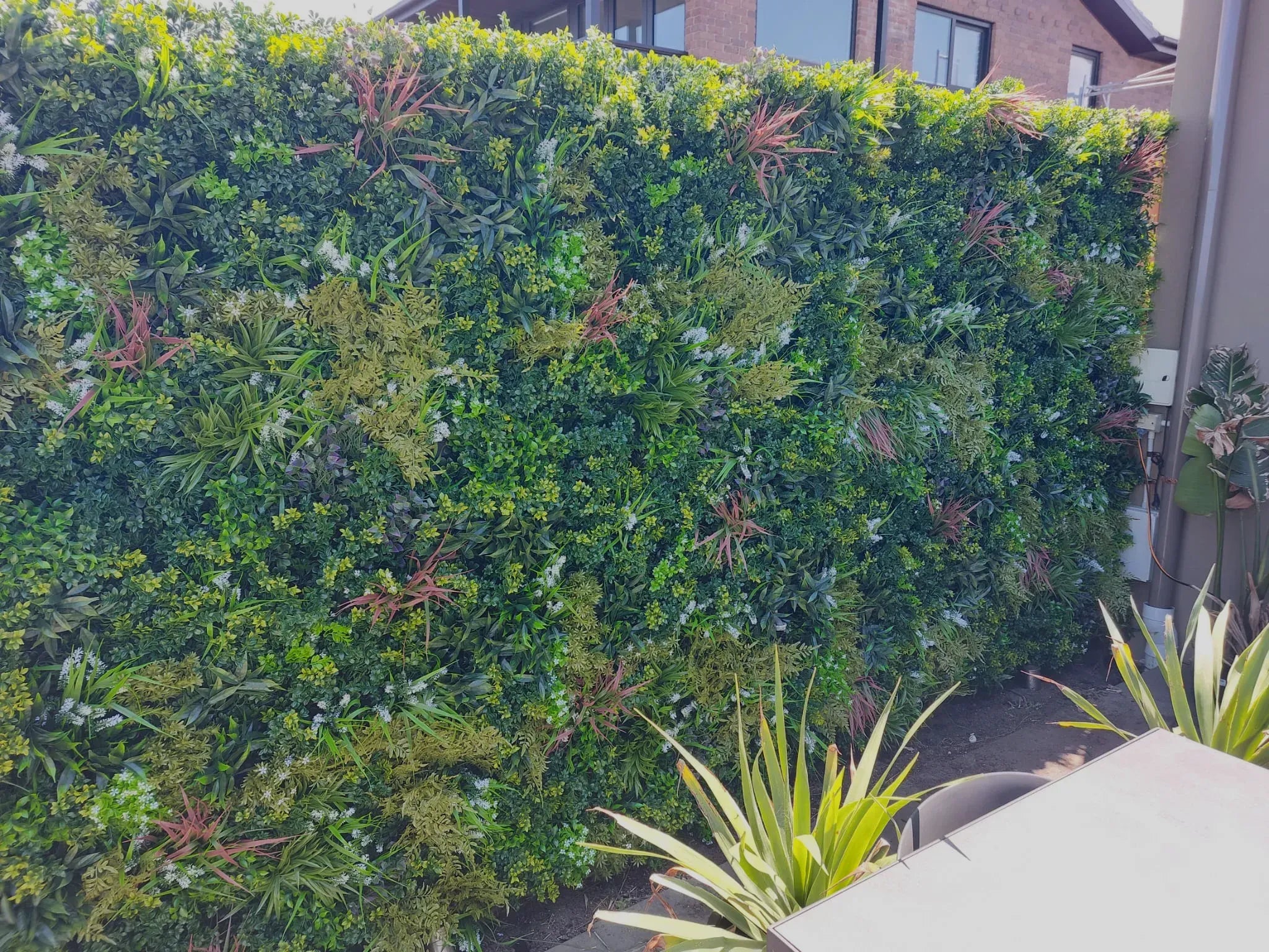 Amazon Jungle artificial vertical garden wall panel by Designer Plants USA, UV resistant living wall for interior or exterior use.