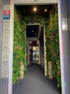 Premium Amazon Jungle artificial vertical garden panel by Designer Plants USA installed in a club, showcasing lush green living wall.