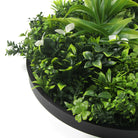 Artificial green wall disc with black frame, UV resistant, commercial-grade living wall from Designer Plants USA.