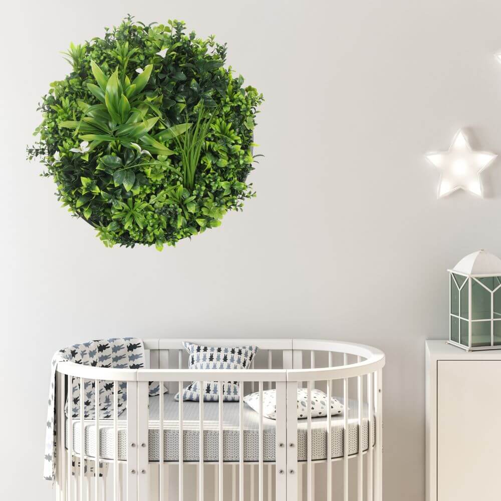 Artificial green wall disc with black frame, UV resistant, commercial grade living wall from Designer Plants USA, ideal for modern interiors.