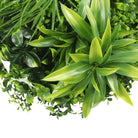 Artificial green wall disc with a white frame, UV resistant, commercial-grade living wall by Designer Plants USA.