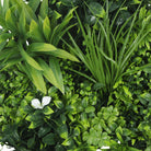 Artificial green wall disc with white frame, UV resistant and commercial grade, designed for living wall installations.