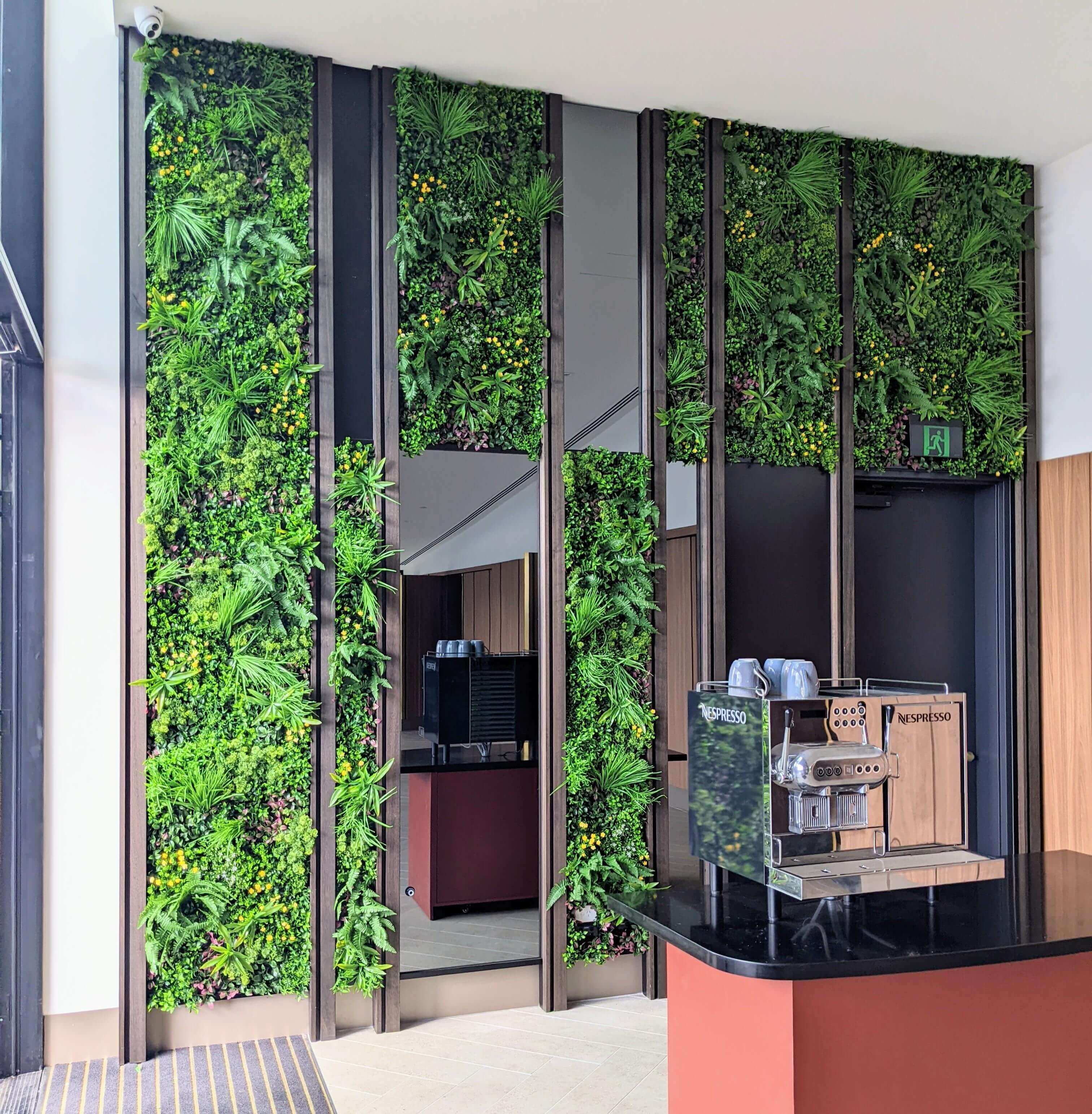 Artificial Country Fern vertical garden panel by Designer Plants USA installed on a hotel wall, UV resistant, 40x40 inch living wall.