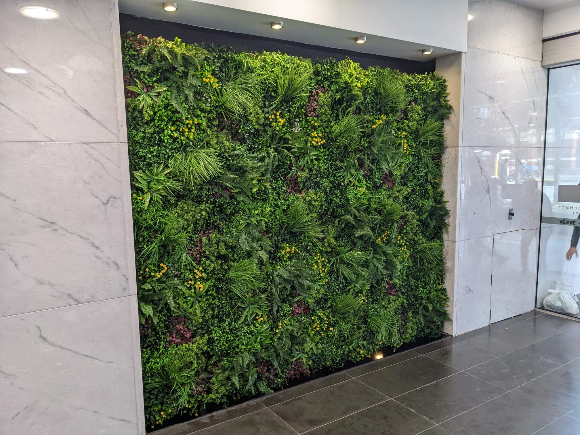 Artificial vertical garden panel by Designer Plants USA, 40x40 inch UV-resistant green wall with lush fern foliage for living walls.