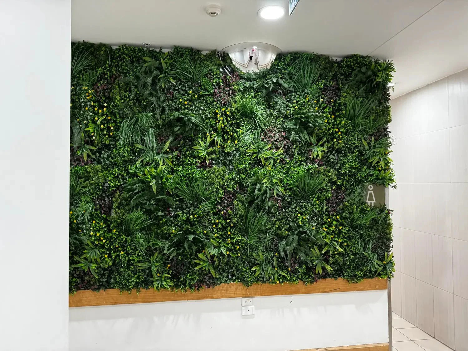 Artificial country fern vertical garden panel by Designer Plants USA, UV resistant green wall for living wall installations.