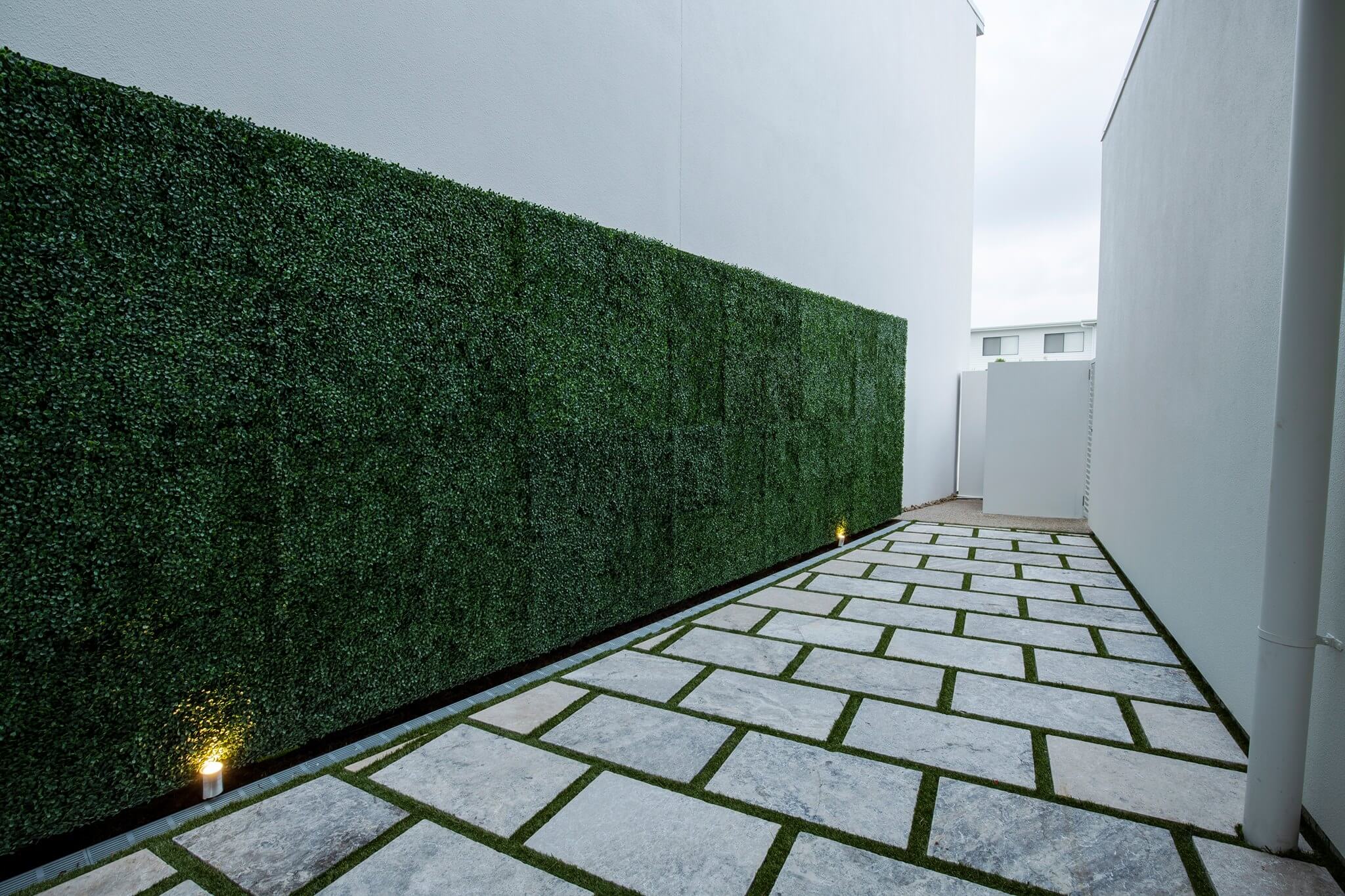 Dark boxwood artificial vertical garden wall panels by Designer Plants USA, UV resistant living wall set of 6 for commercial use.