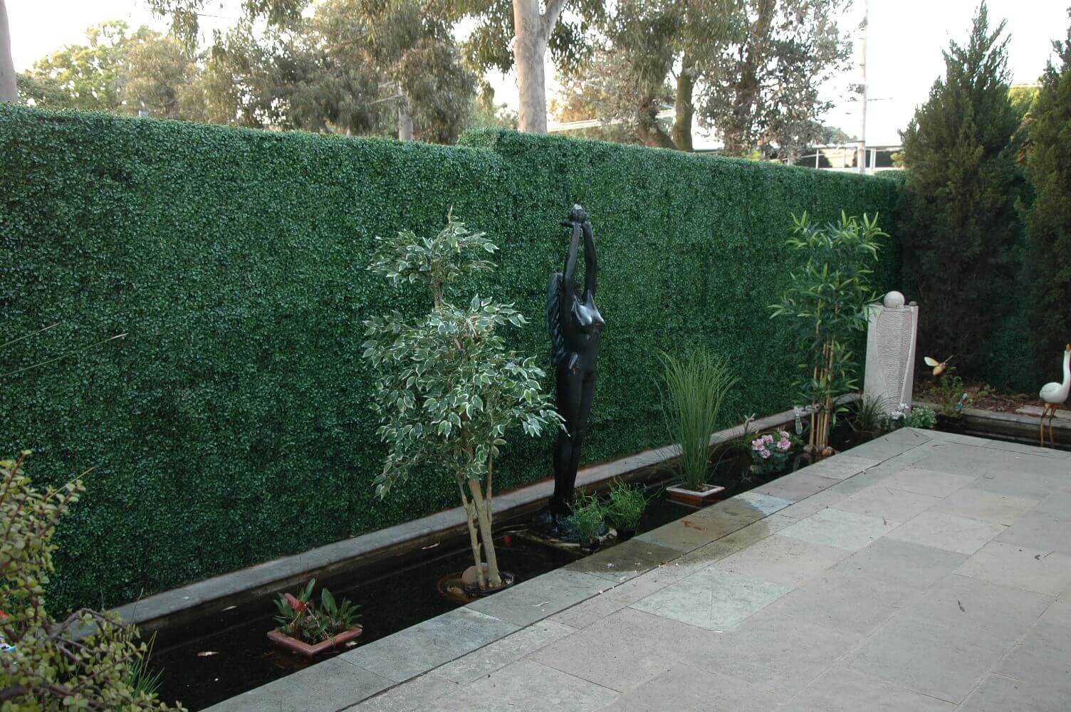 Artificial dark boxwood vertical garden panels by Designer Plants USA, UV resistant living wall set of 6 for commercial or home use.