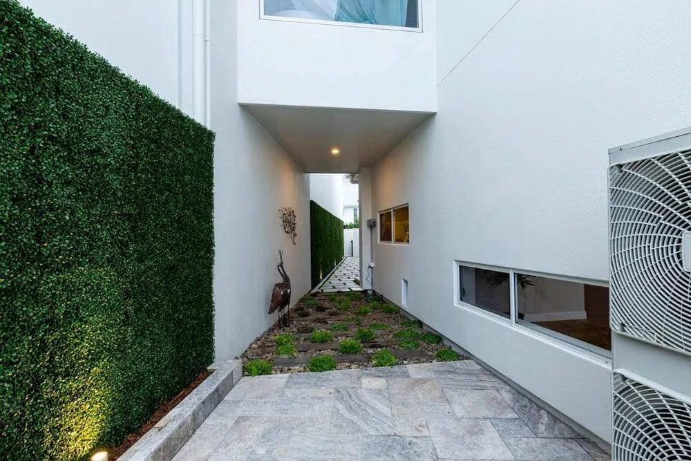Dark green artificial boxwood panels from Designer Plants USA, 6-pack vertical garden wall set, UV resistant, ideal for living wall decor.