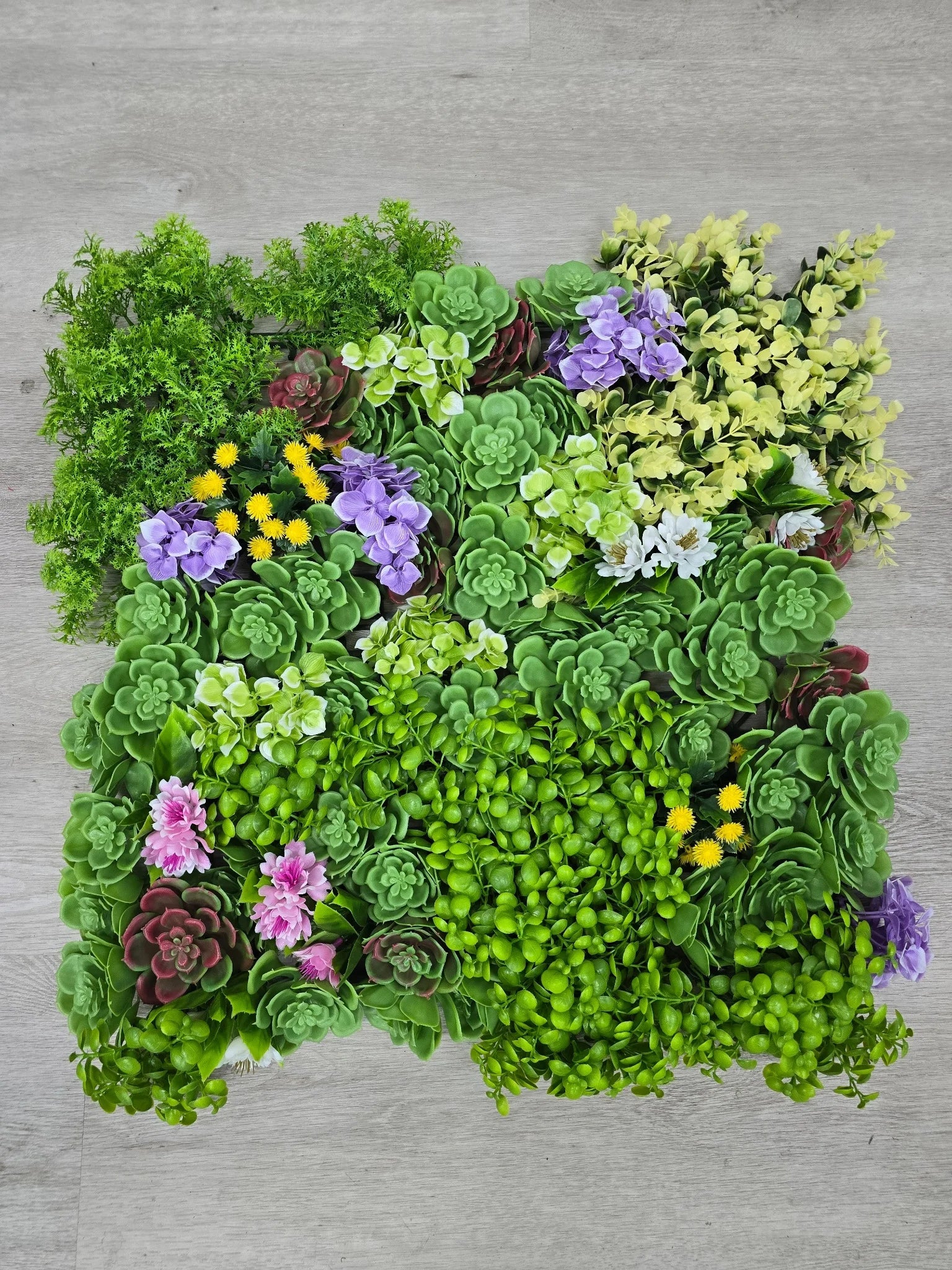 Artificial dense succulent wall panel by Designer Plants USA, UV resistant living wall with lush green succulents, 20x20 inches.