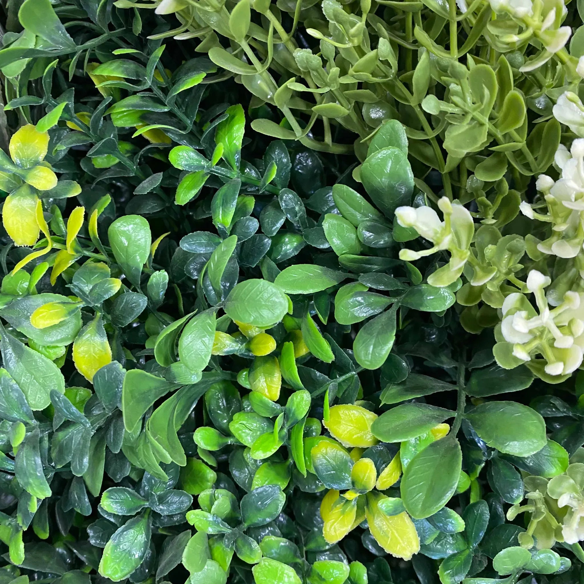Artificial vertical garden wall panels by Designer Plants USA, UV resistant living wall panels for commercial green wall displays.