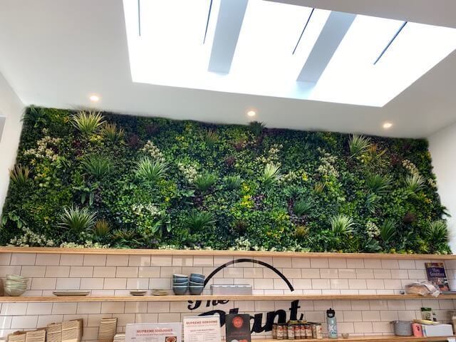 Artificial vertical garden panels by Designer Plants USA, triptych living wall set with lush green foliage, UV resistant, 33 sq ft.