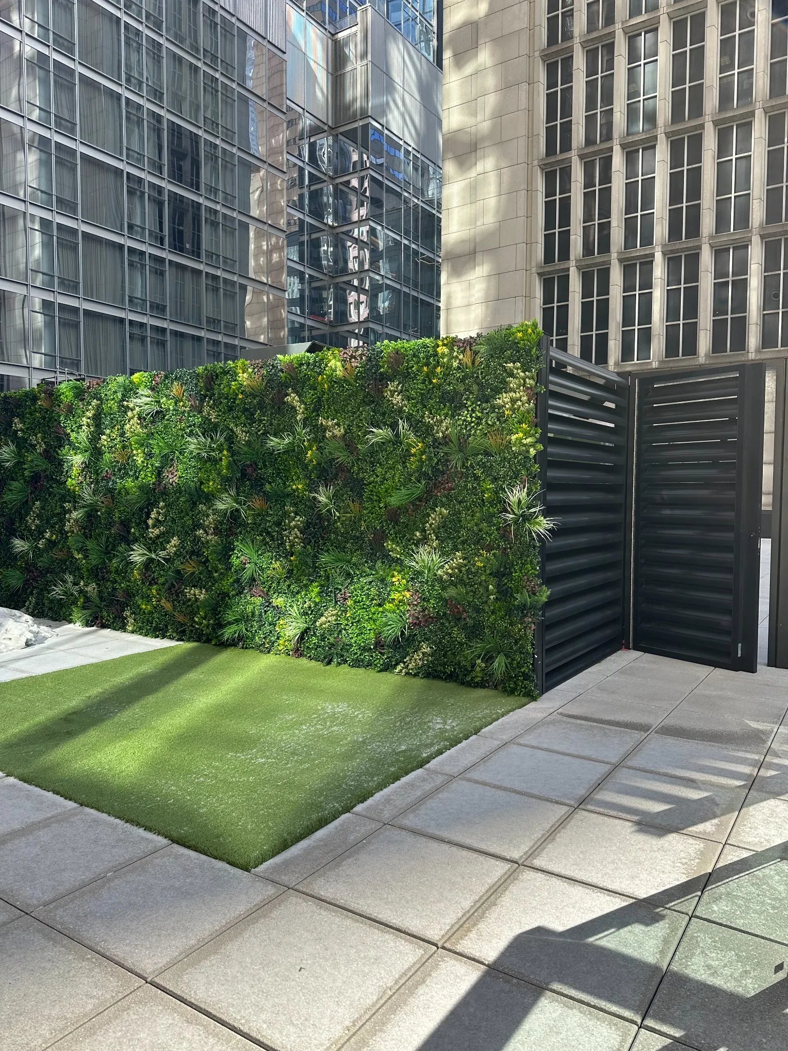 Modern artificial green wall panel set by Designer Plants USA, featuring lush vertical garden panels for urban decor.