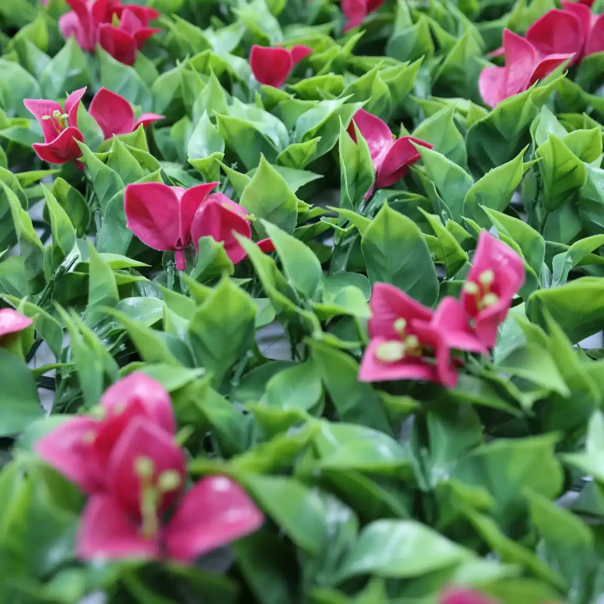 Pink flowering artificial vertical garden panel by Designer Plants USA, UV-resistant living wall with vibrant pink flowers and greenery.
