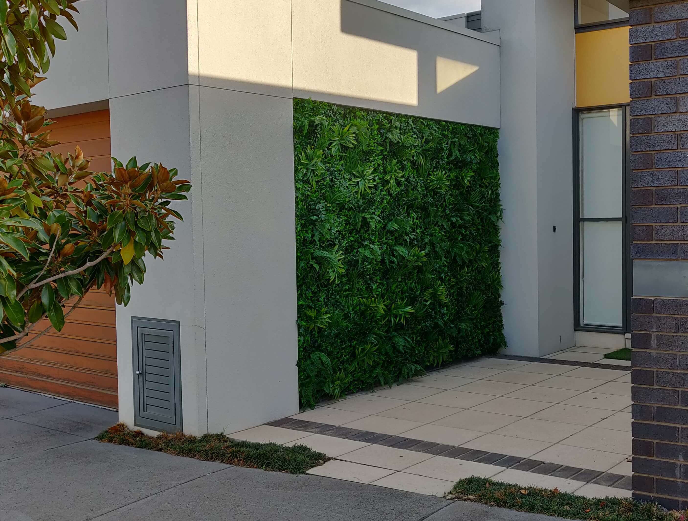 Artificial Green Tropics vertical garden wall panel by Designer Plants USA, UV resistant living wall for commercial use.