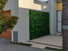 Artificial Green Tropics vertical garden wall panel by Designer Plants USA, UV resistant living wall for commercial use.
