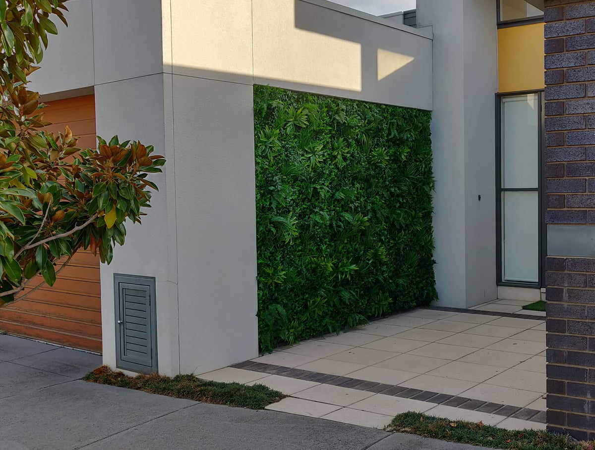 Artificial Green Tropics vertical garden wall panel by Designer Plants USA, UV resistant living wall for commercial use.