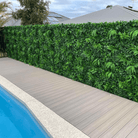 Green Tropics artificial vertical garden green wall panel by Designer Plants USA in a pool area, UV resistant, 40x40 inches, commercial grade