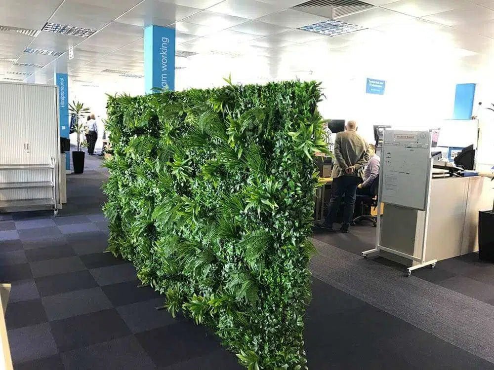 Green Tropics artificial vertical garden panel by Designer Plants USA, UV-resistant living wall for office partition or green wall decor.