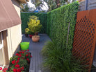 Artificial jasmine green wall panel by Designer Plants USA, 40x40 inch vertical garden with UV-resistant, commercial-grade living wall design.