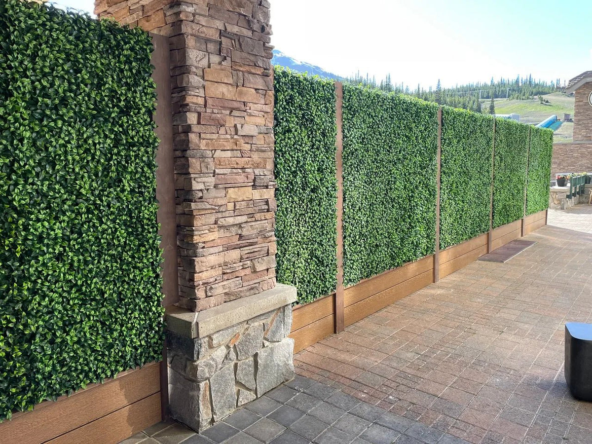 Artificial jasmine green wall panel from Designer Plants USA, 40x40 inch vertical garden for indoor or outdoor living wall decor.