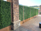 Artificial jasmine green wall panel from Designer Plants USA, 40x40 inch vertical garden for indoor or outdoor living wall decor.