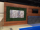 Artificial green wall panel by Designer Plants USA installed at a pool shop, featuring lush faux hedge panels and metal wall art.