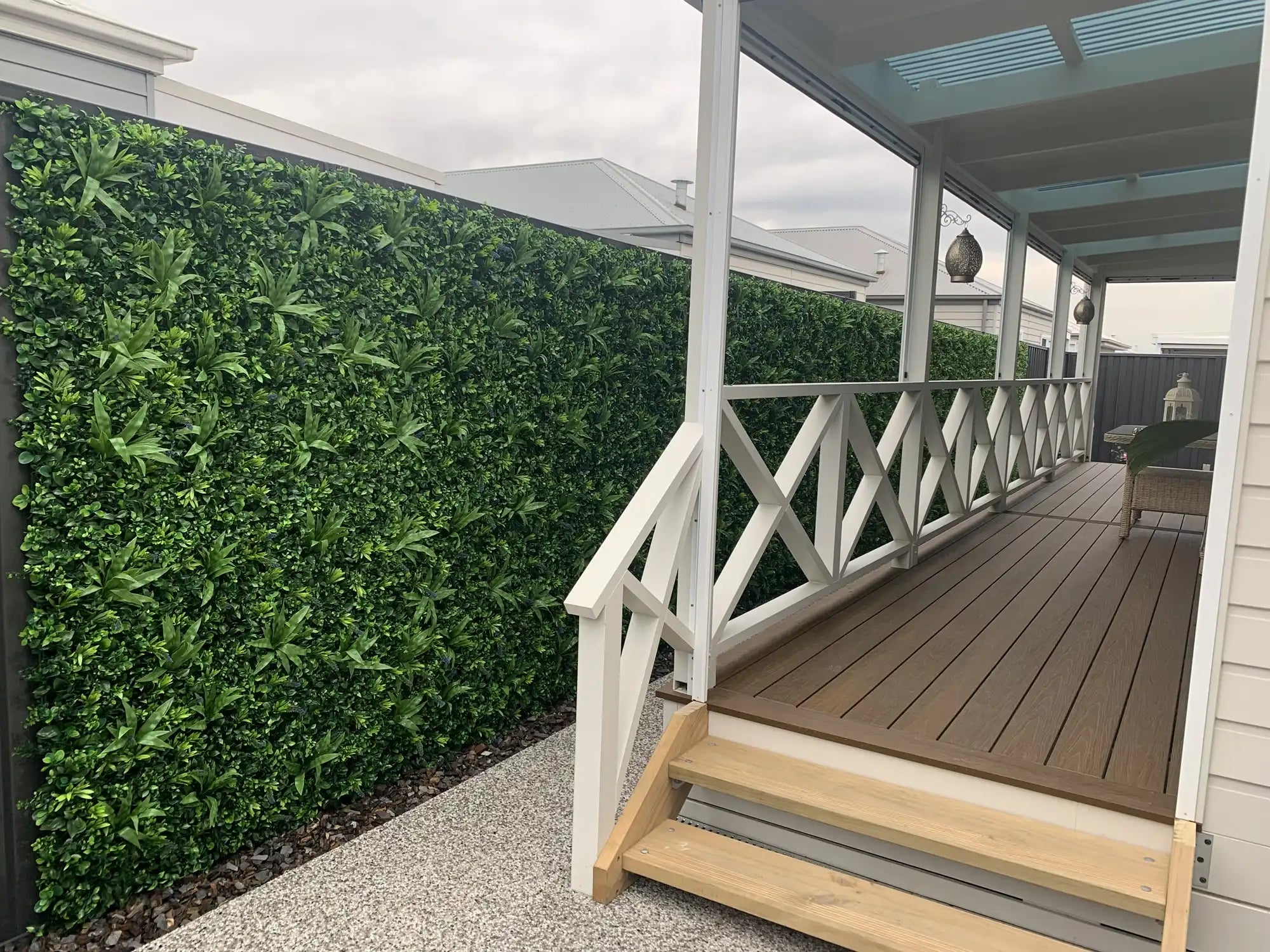 Artificial lavender-filled vertical garden panel by Designer Plants USA, UV resistant green wall for commercial and home decor.