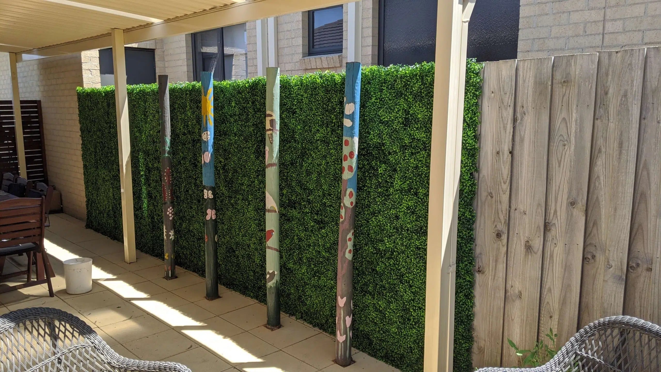 Artificial boxwood hedge panel from Designer Plants USA, 40x40 inch vertical garden wall for outdoor living spaces.