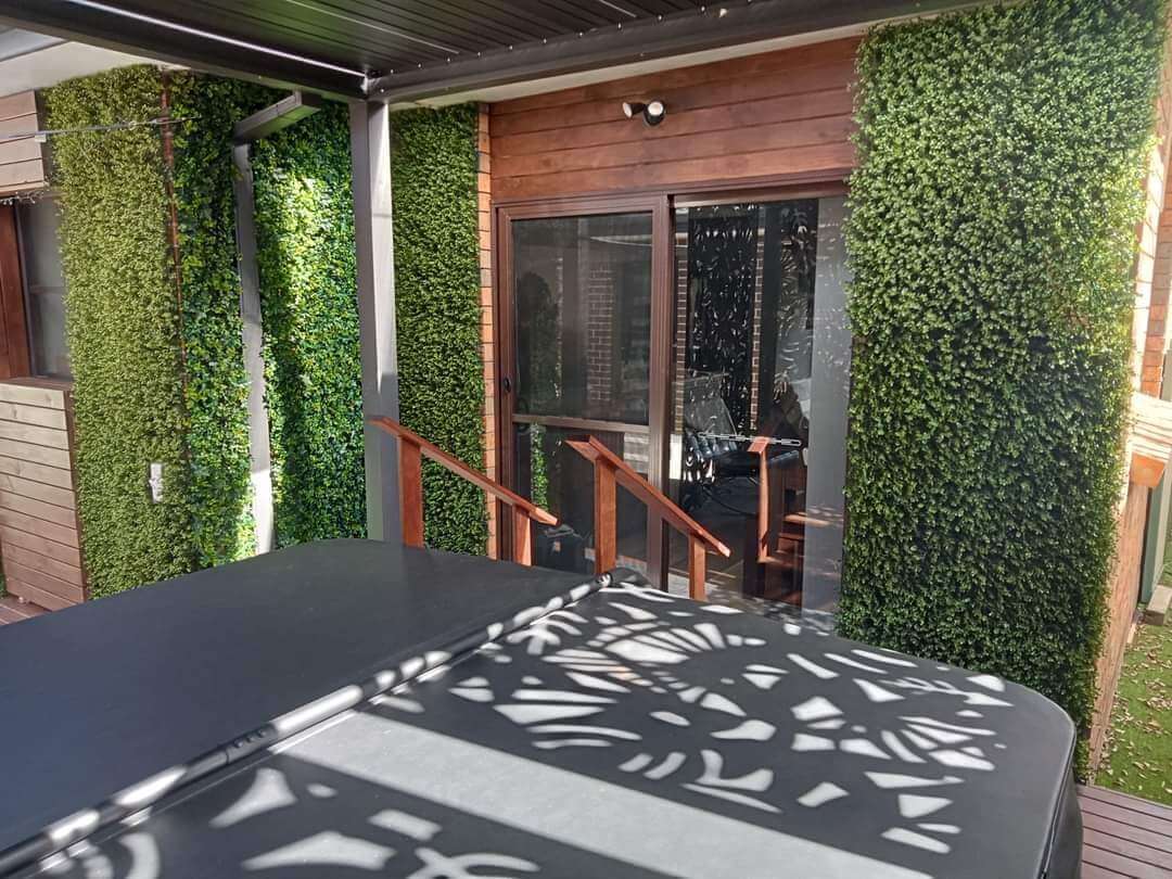 Artificial boxwood hedge panel for vertical garden, green wall, UV resistant, 40x40 inches, commercial-grade living wall from Designer Plants USA.